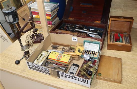 A collection of professional watch makers tools and reference books